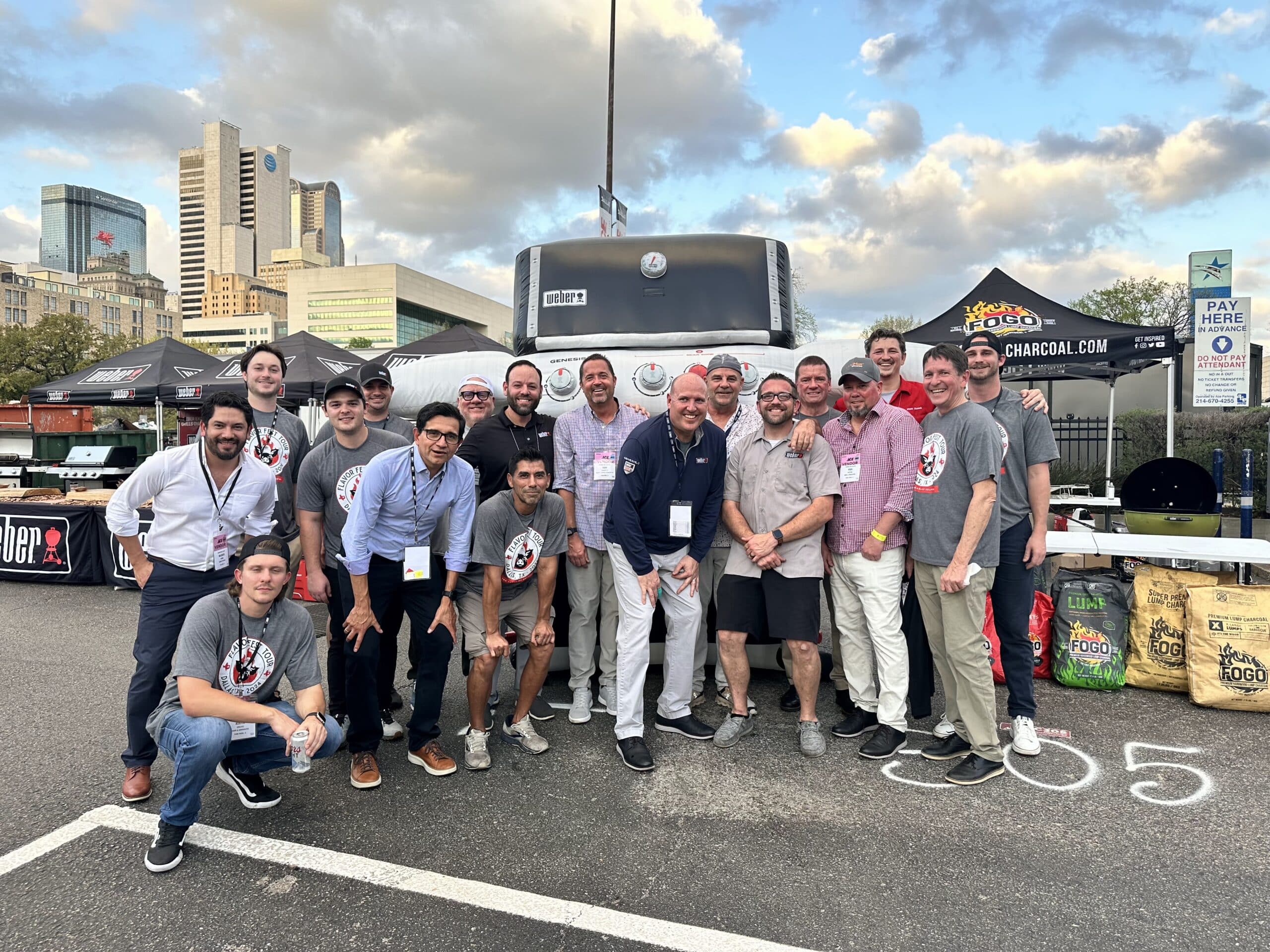 Group photo in front of Weber grill inflatable