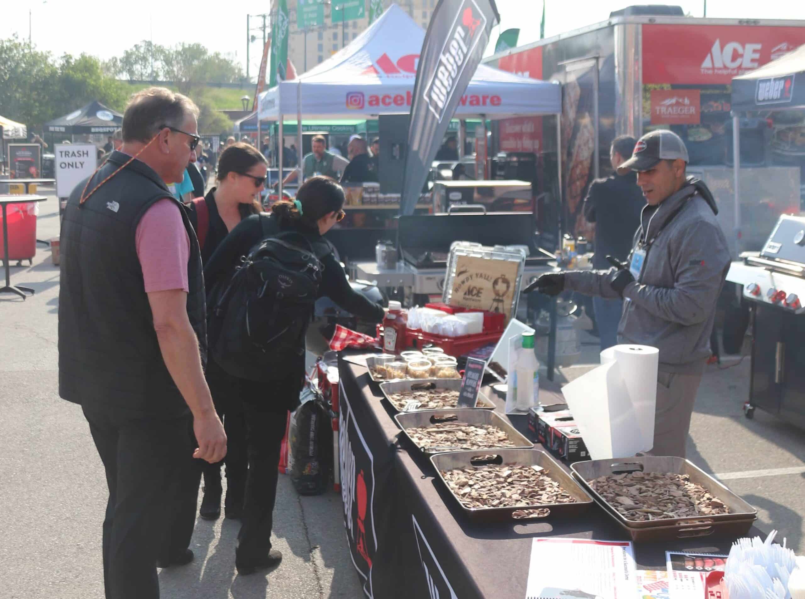 Outdoor street fest with grilled food being served